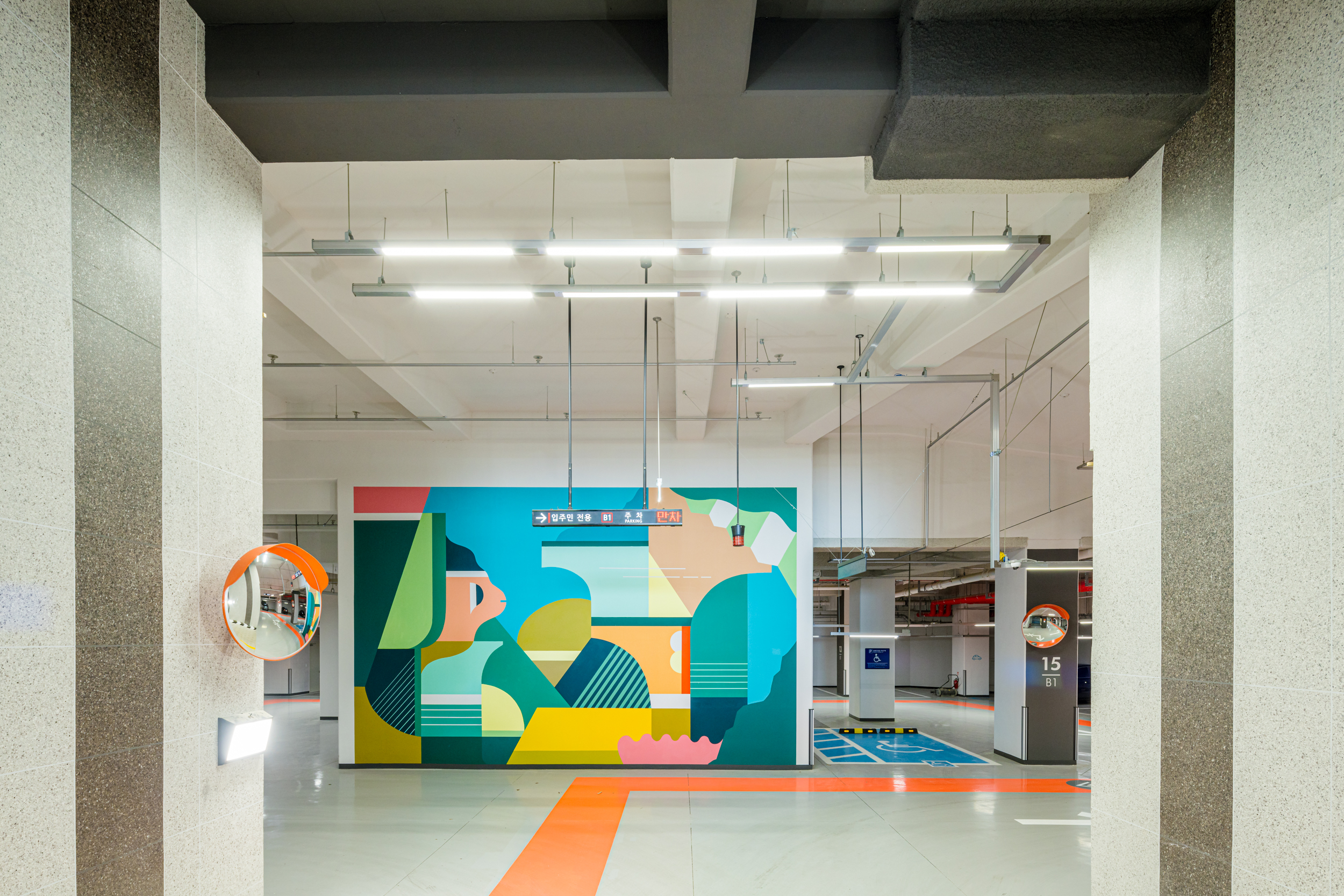 Art walls created by the artist Junkhouse painted on large walls  in the underground parking lot