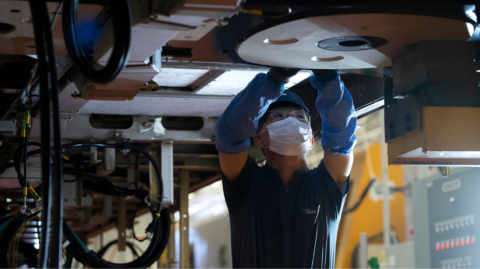 A worker during the internal maintenance of a train