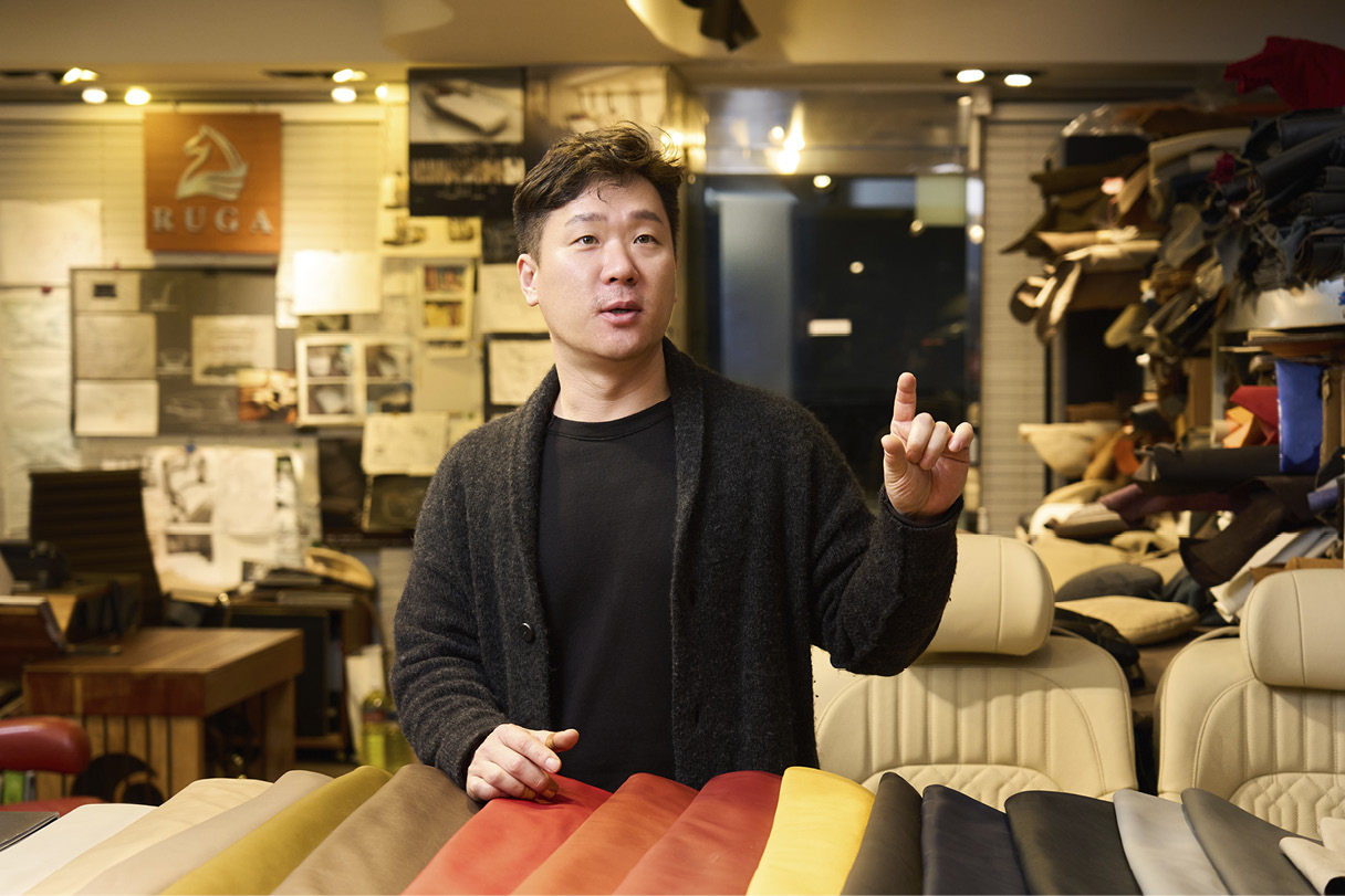 Moon-yong Lee, manager of Luga Seat, a car seat manufacturer, talking about a piece leather on the front