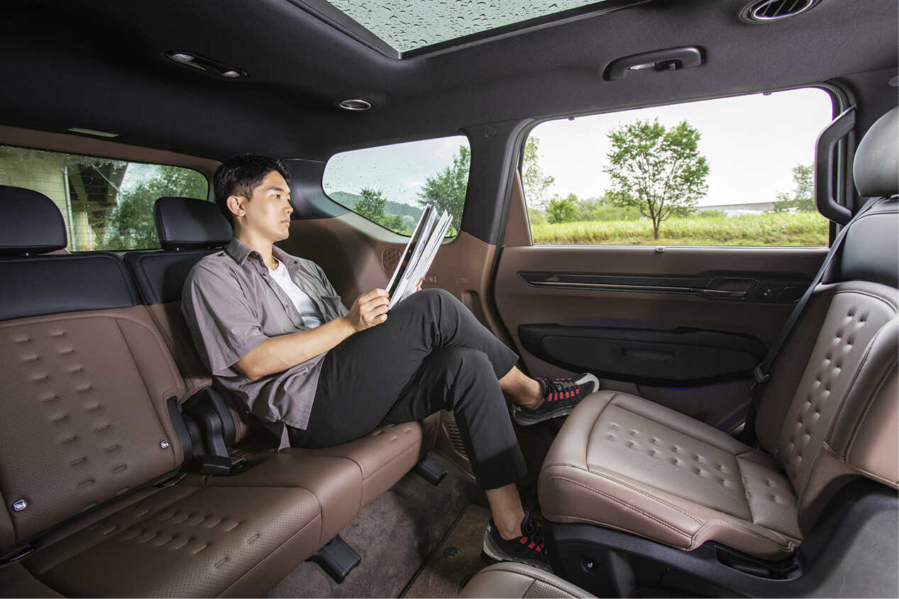 A man taking a rest while sitting on the 3rd row seat of EV9