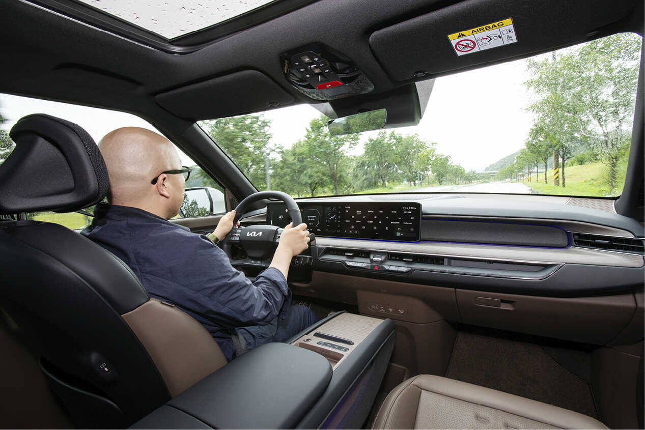 A man driving an EV9