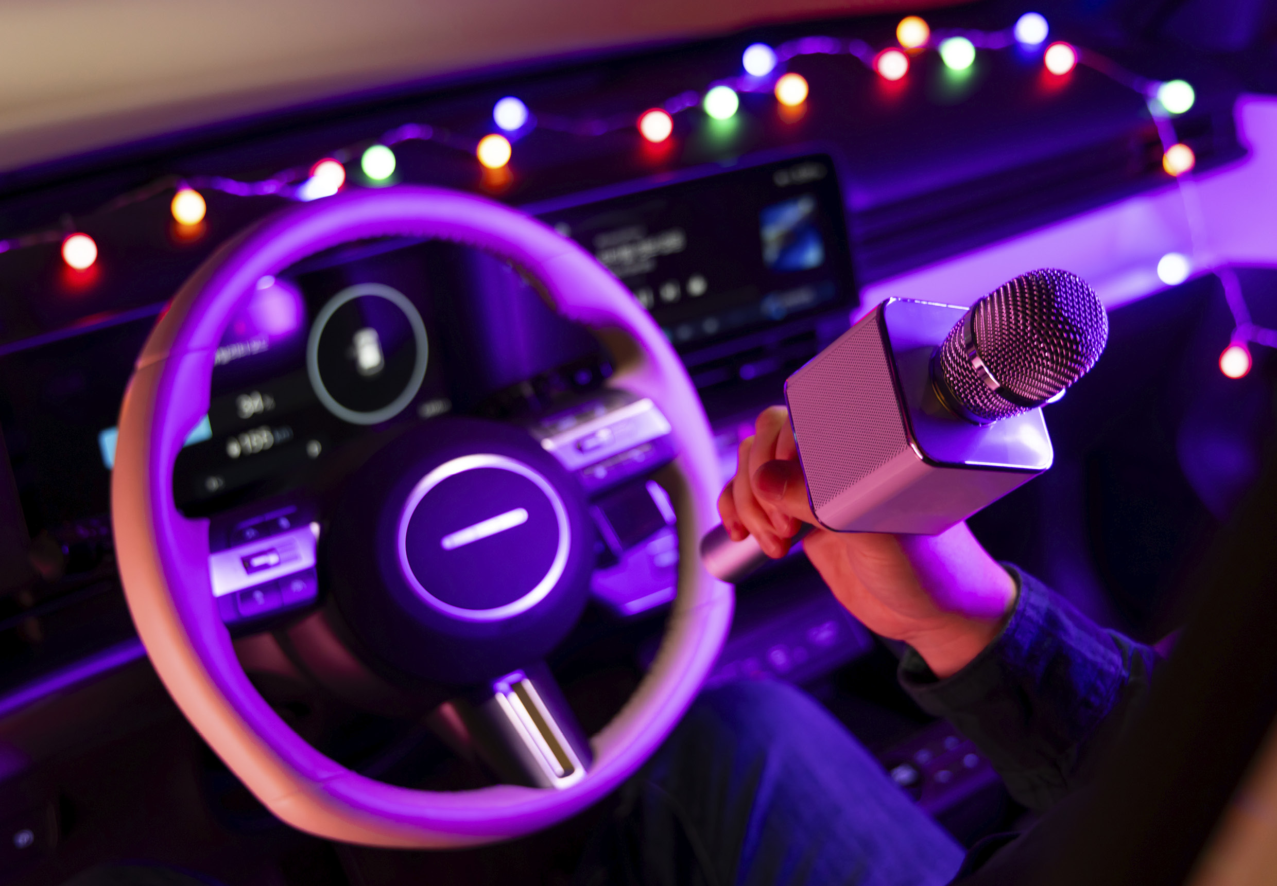 A person singing on a Kona Electric