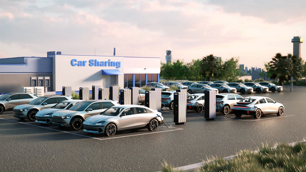 several electric vehicles charging in a parking lot