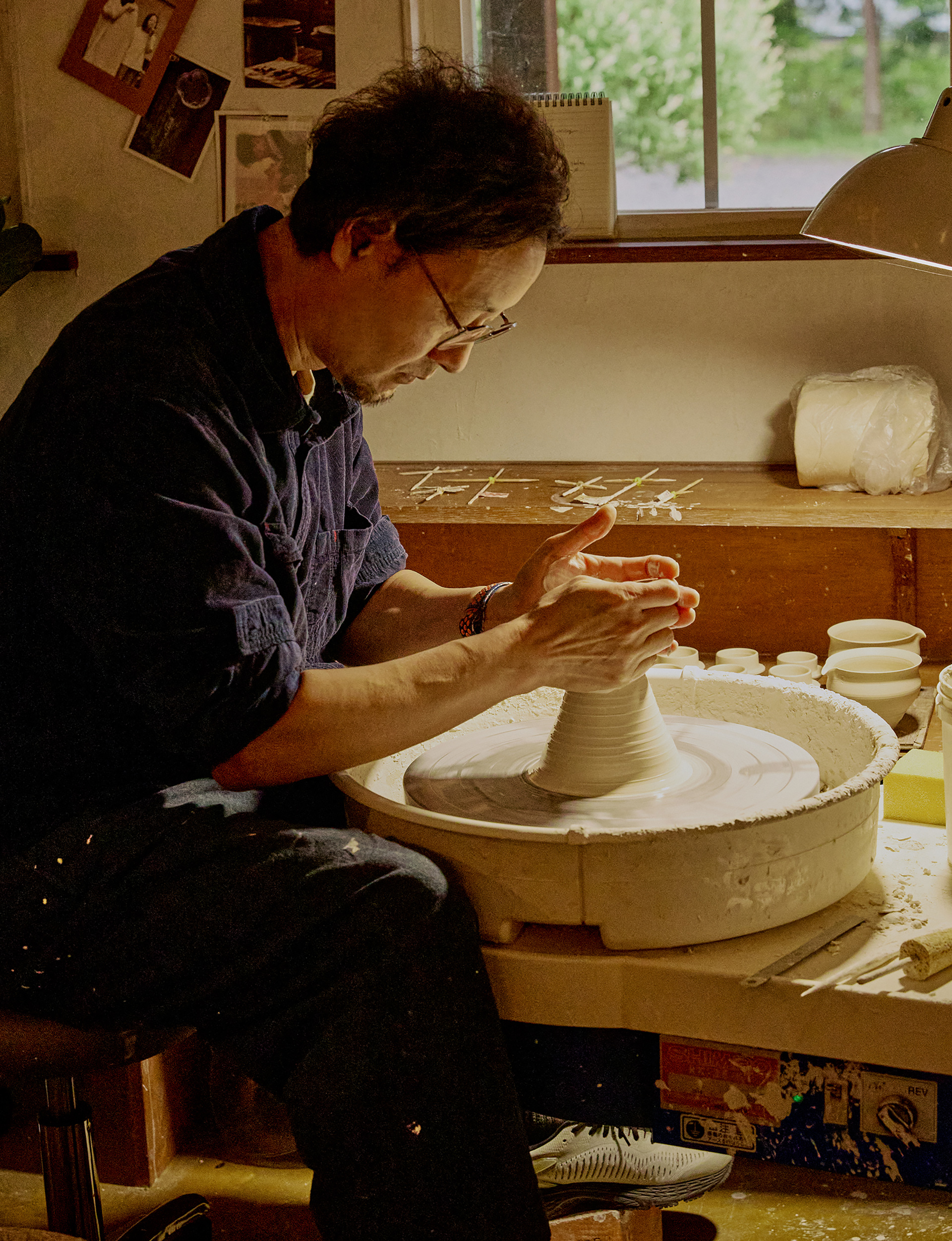 An artist crafting pottery by hand