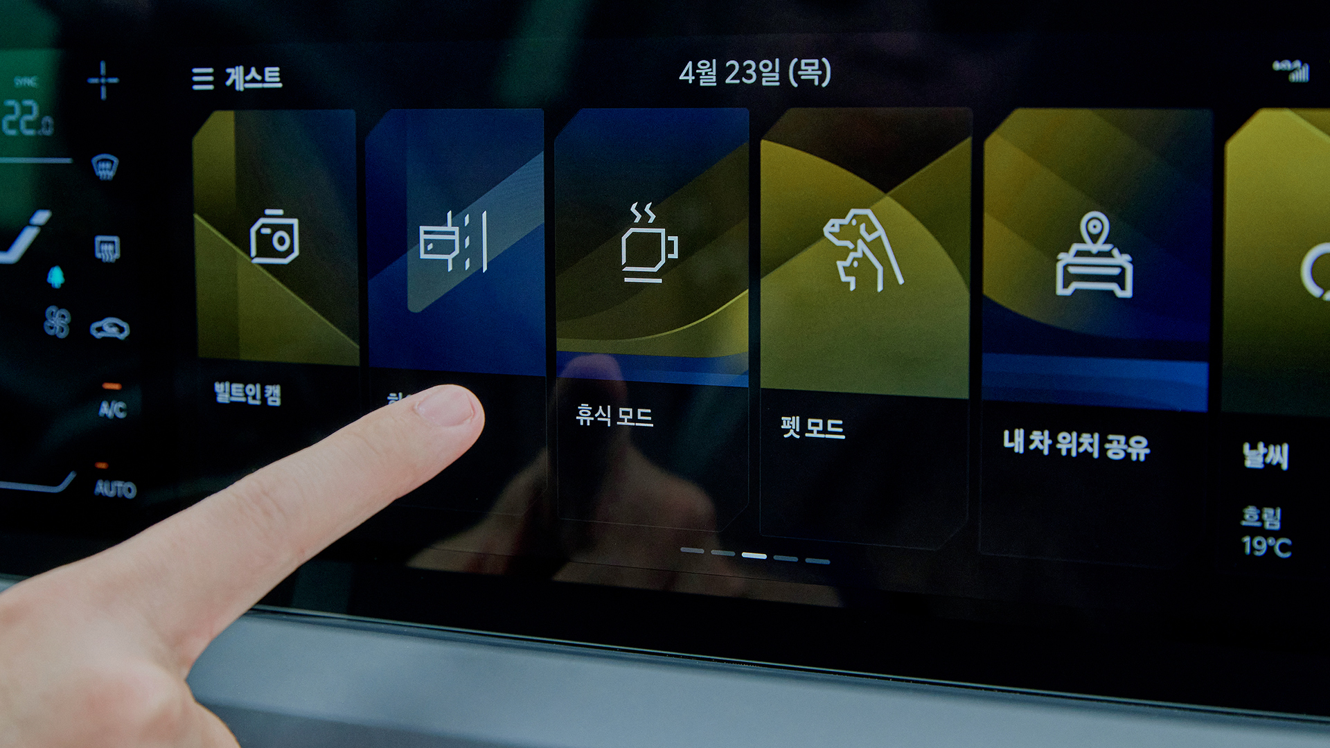 A driver operating the navigation system on the Kia EV5 infotainment display
