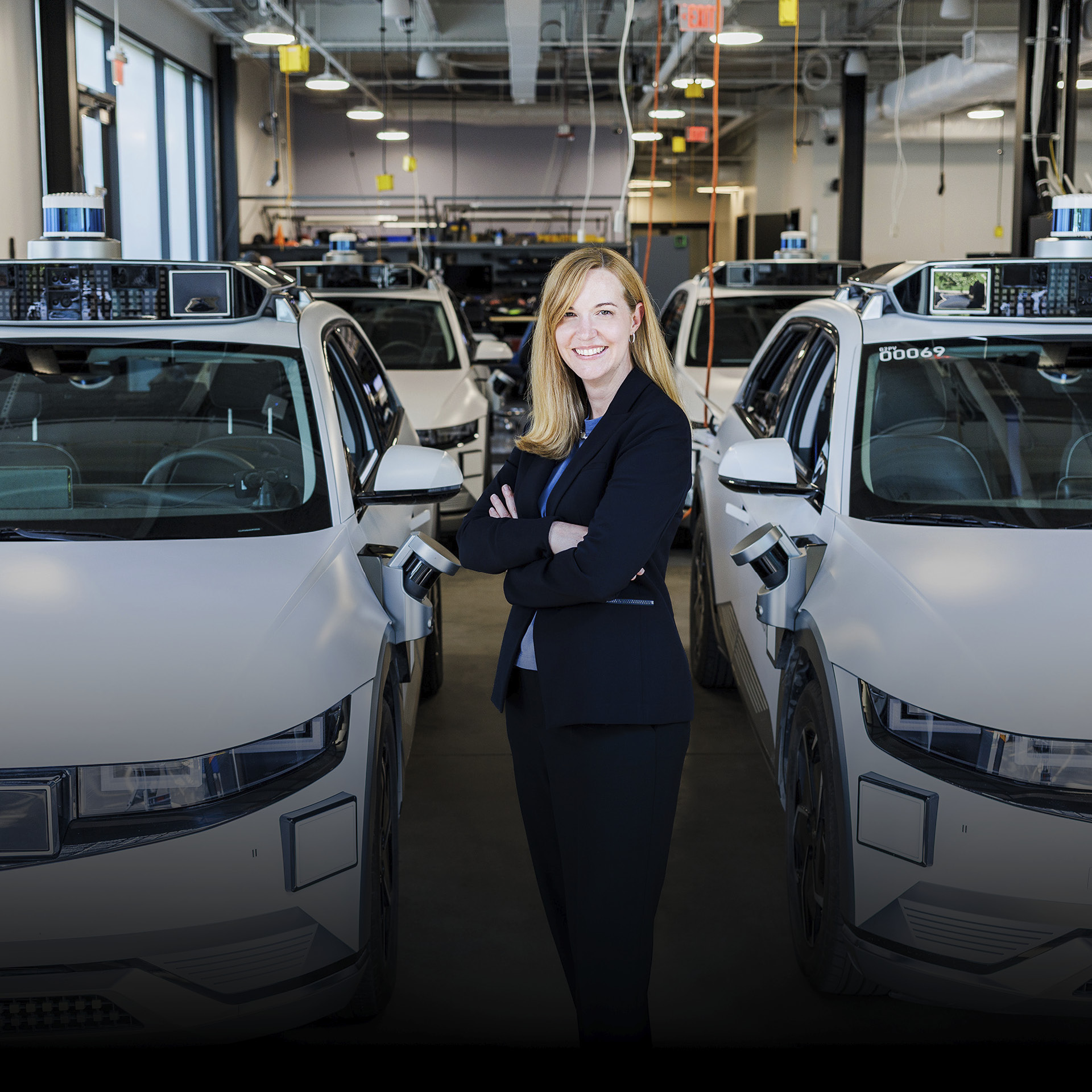 Laura Major stand with Motional RoboTaxi