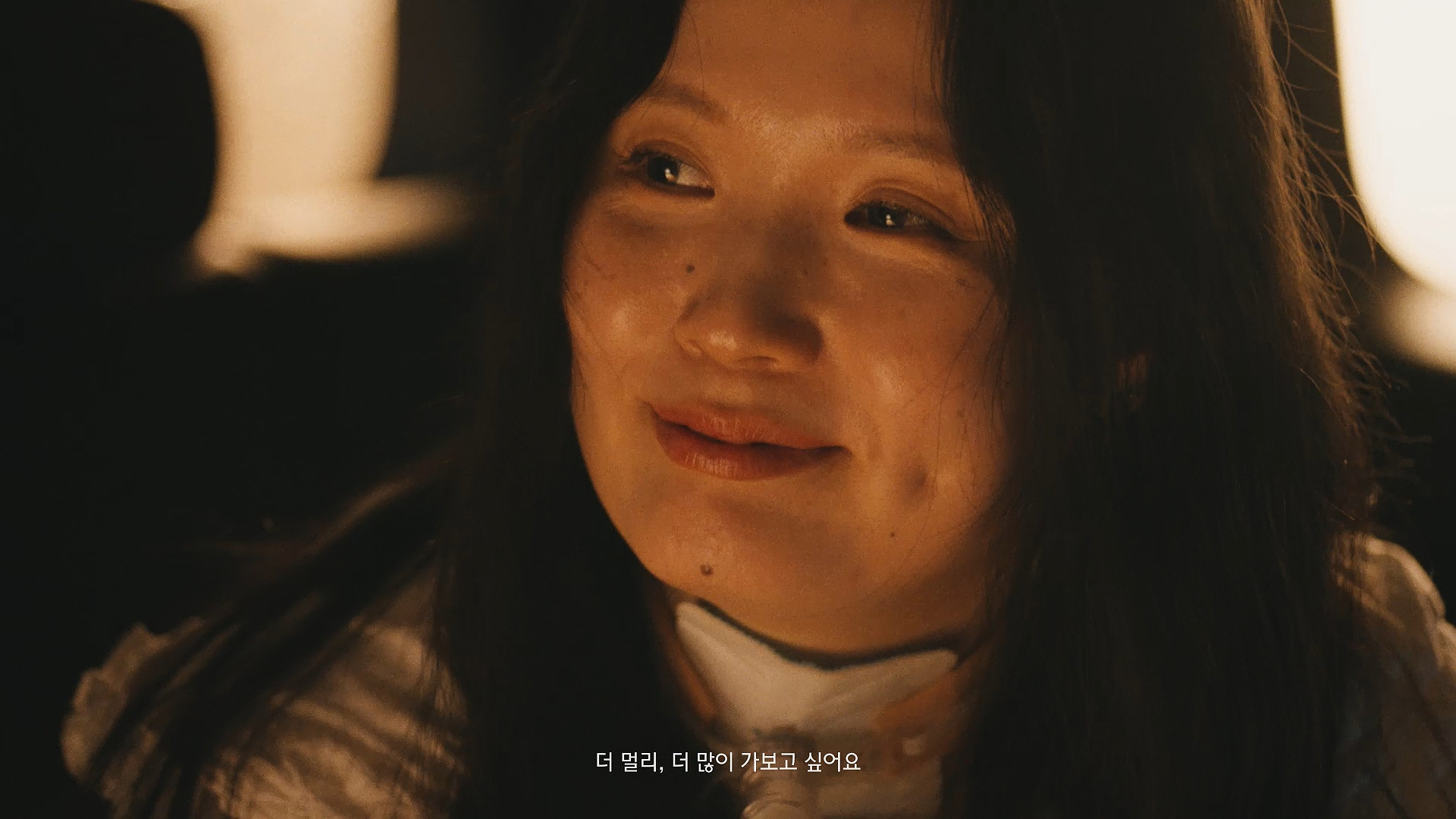 A smiling face (Image text: I want to go farther. I want to see more.)