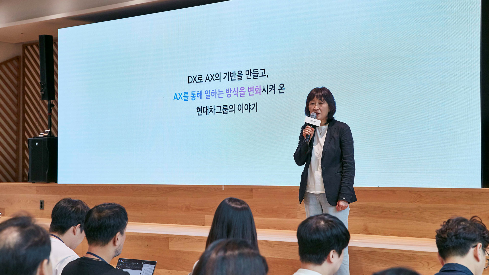 Eunsook Jin, President and Head of ICT Management Division at Hyundai Motor Group, delivers a presentation at the Hyundai Motor Group AX Achievement Showcase, “Beyond AI, Transforming the Way We Work,” held at the Group’s headquarters in Yangjae on August 12. (1)
