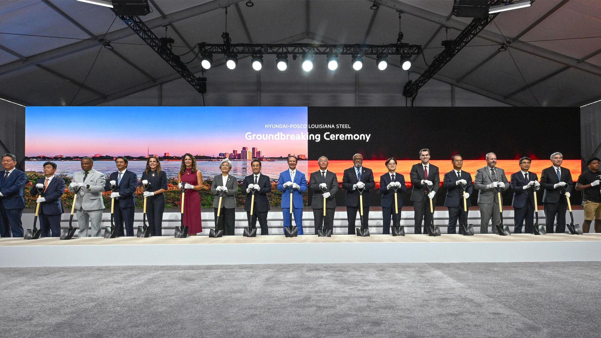 Key attendees who took part in the groundbreaking ceremony to mark the start of factory construction pose for a commemorative photo. From left: Hyundai Motor Group President Gang-hyeon Seo; POSCO Vice President Gwang-mu Kim; Donaldsonville Mayor Leroy Sullivan; Hyundai Motor Company President José Muñoz; Louisiana Secretary of Economic Development Susan Bourgeois; U.S. Representative Julia Letlow; Republic of Korea Ambassador to the United States Kyung-wha Kang; POSCO Group Chairman In-hwa Jang; Louisiana Governor Jeff Landry; Hyundai Motor Group Executive Chair Euisun Chung; U.S. Representative Troy Carter; Minister of Trade, Industry and Energy Jeong-kwan Kim; William Kimmitt, Deputy Under Secretary of Commerce for International Trade; Hyundai Steel President Bo-ryong Lee; Ascension Parish President Clint Cointment; Kia President Ho-sung Song; Hyundai Motor Group President Sung Kim; and River Parishes Community College (RPCC) student Cortaz Johnson.