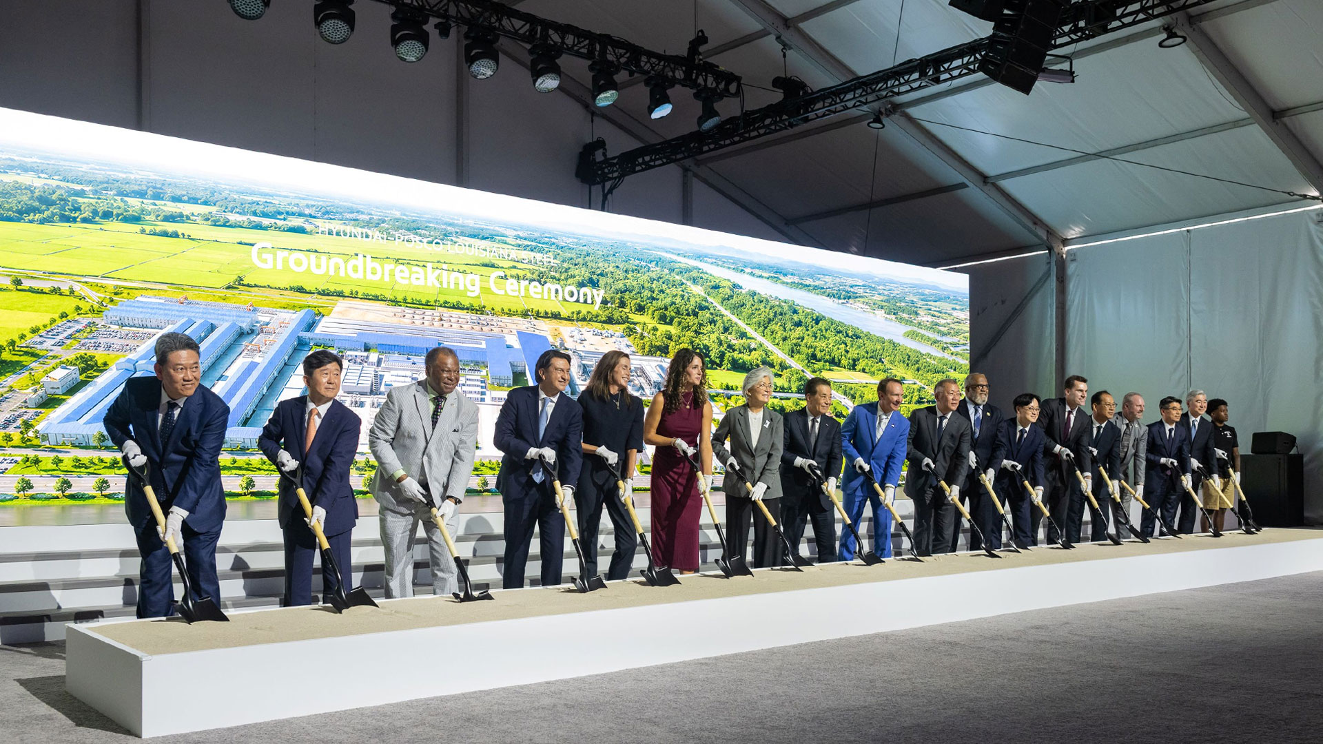 Key attendees at the groundbreaking ceremony break ground to mark the start of factory construction. From left: Hyundai Motor Group President Gang-hyeon Seo; POSCO Vice President Gwang-mu Kim; Donaldsonville Mayor Leroy Sullivan; Hyundai Motor Company President José Muñoz; Louisiana Secretary of Economic Development Susan Bourgeois; U.S. Representative Julia Letlow; Republic of Korea Ambassador to the United States Kyung-wha Kang; POSCO Group Chairman In-hwa Jang; Louisiana Governor Jeff Landry; Hyundai Motor Group Executive Chair Euisun Chung; U.S. Representative Troy Carter; Minister of Trade, Industry and Energy Jeong-kwan Kim; William Kimmitt, Deputy Under Secretary of Commerce for International Trade; Hyundai Steel President Bo-ryong Lee; Ascension Parish President Clint Cointment; Kia President Ho-sung Song; Hyundai Motor Group President Sung Kim; and River Parishes Community College (RPCC) student Cortaz Johnson.