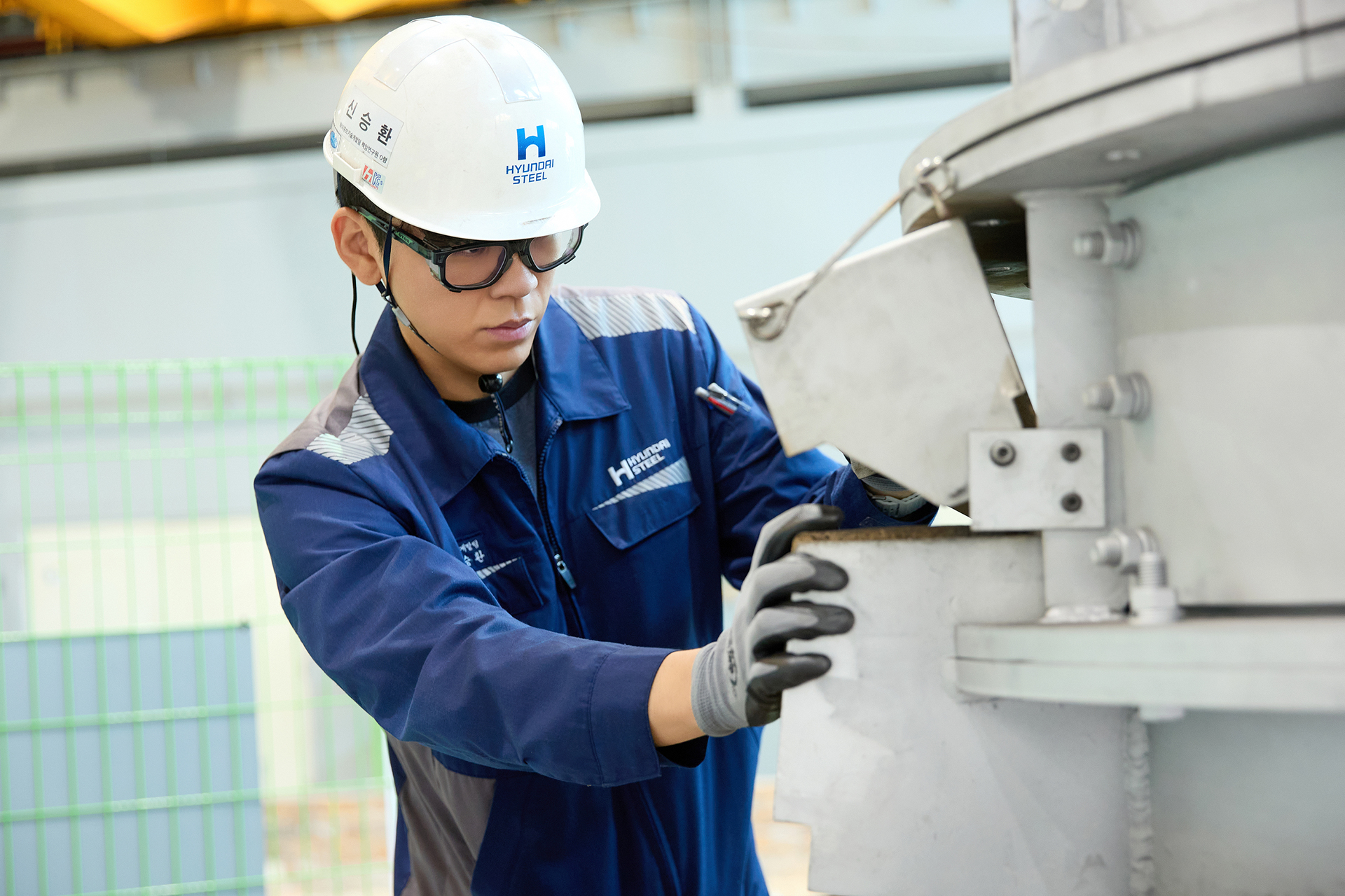Seunghwan Shin, Senior Research Engineer at Hyundai Steel, working at a production site
