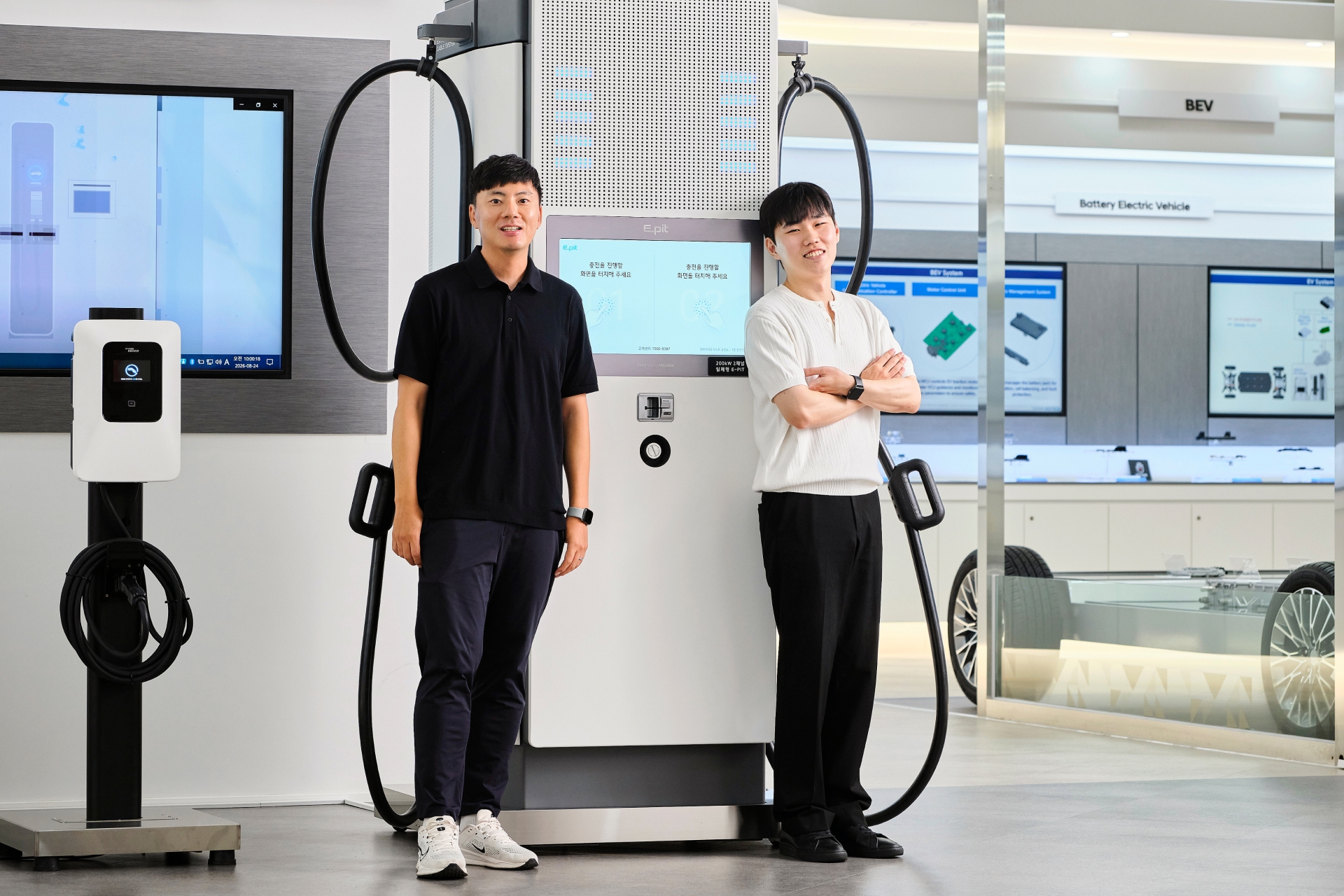 Changseok Oh, Senior Manager on the EV Charger Business Management Team, and Seunghun Hyun, Research Engineer on the EV Charger Development Team