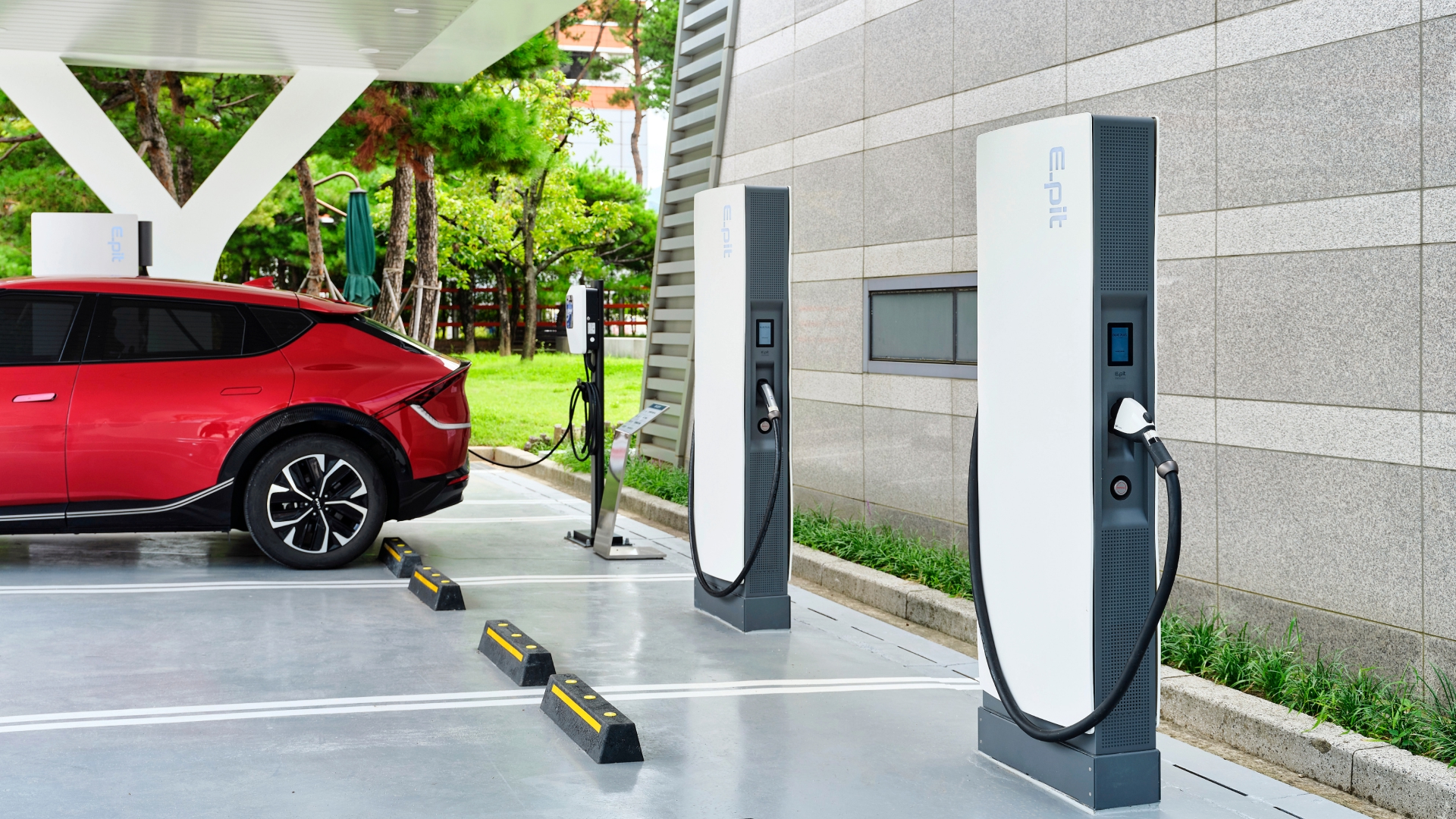 An electric vehicle connected to an EV charger