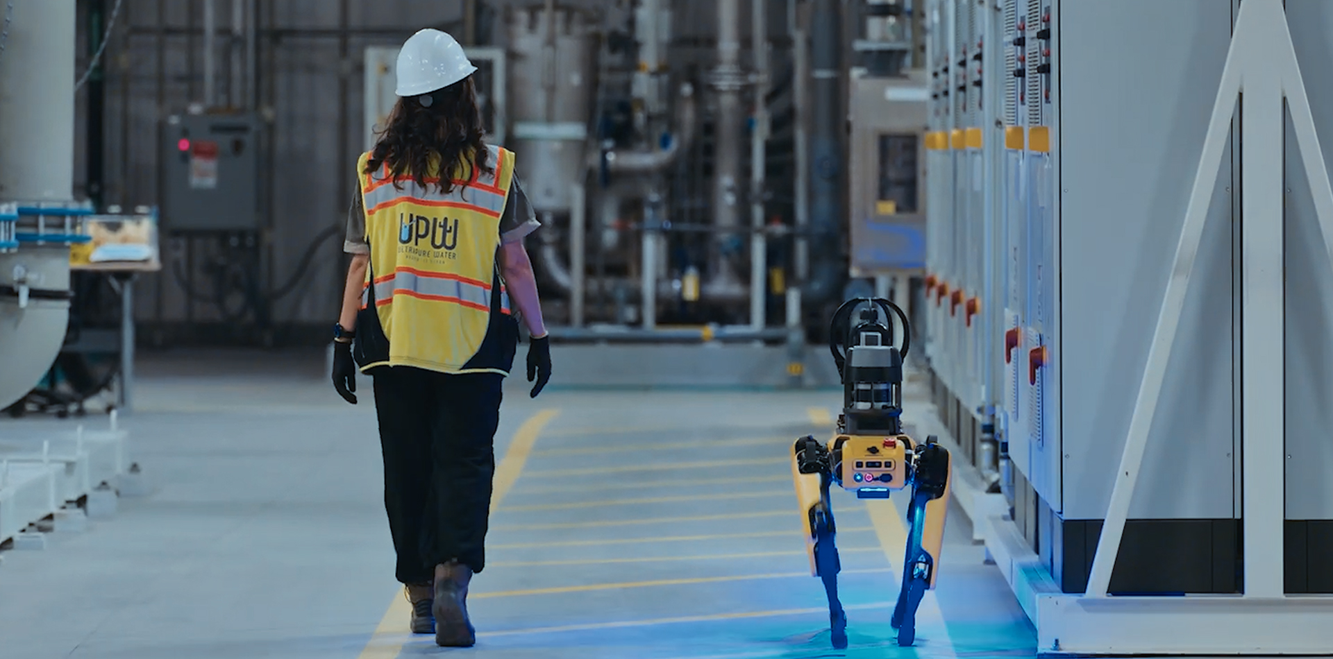 Worker walking alongside Spot