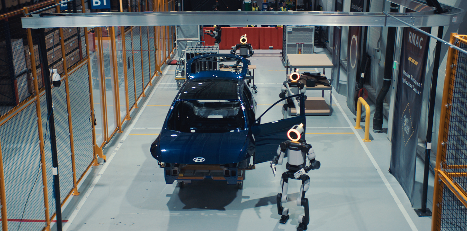 Boston Dynamics Atlas performing a task at an automotive manufacturing plant