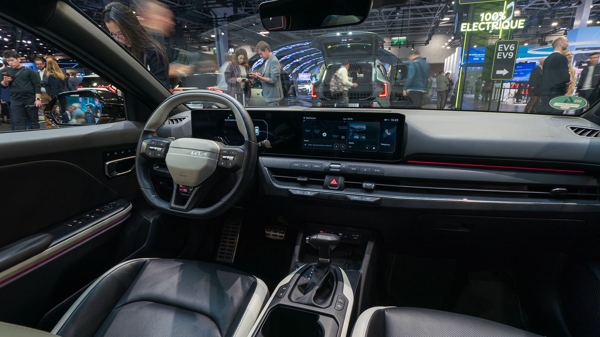 Interior of the Kia K4 displayed at the 2026 Paris Motor Show exhibition hall