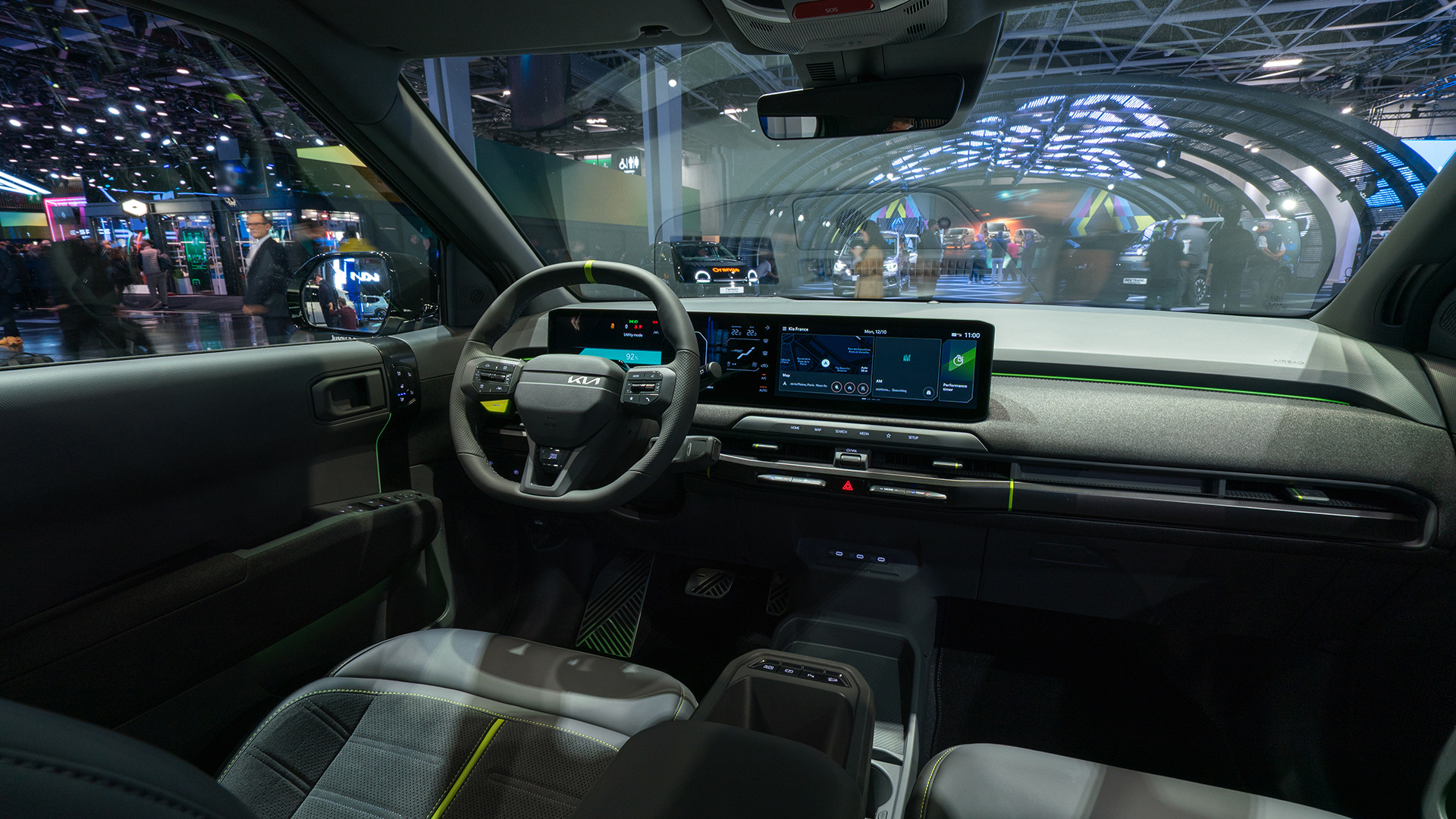 The interior of the Kia EV3 displayed at the 2026 Paris Motor Show venue